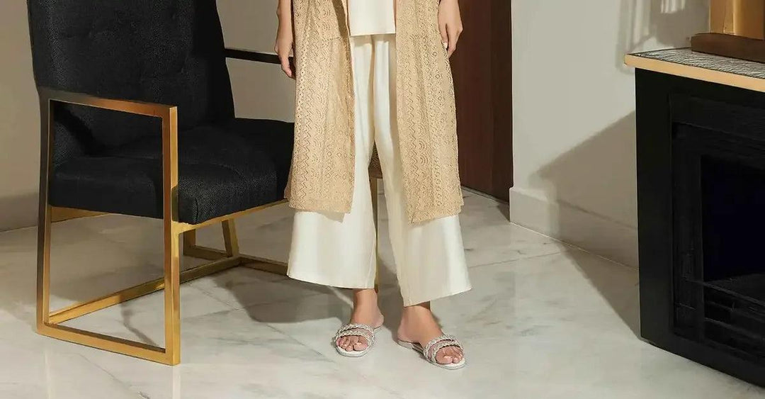 women wearing stylish casual slip-on shoes with braided straps indoors on marble floor