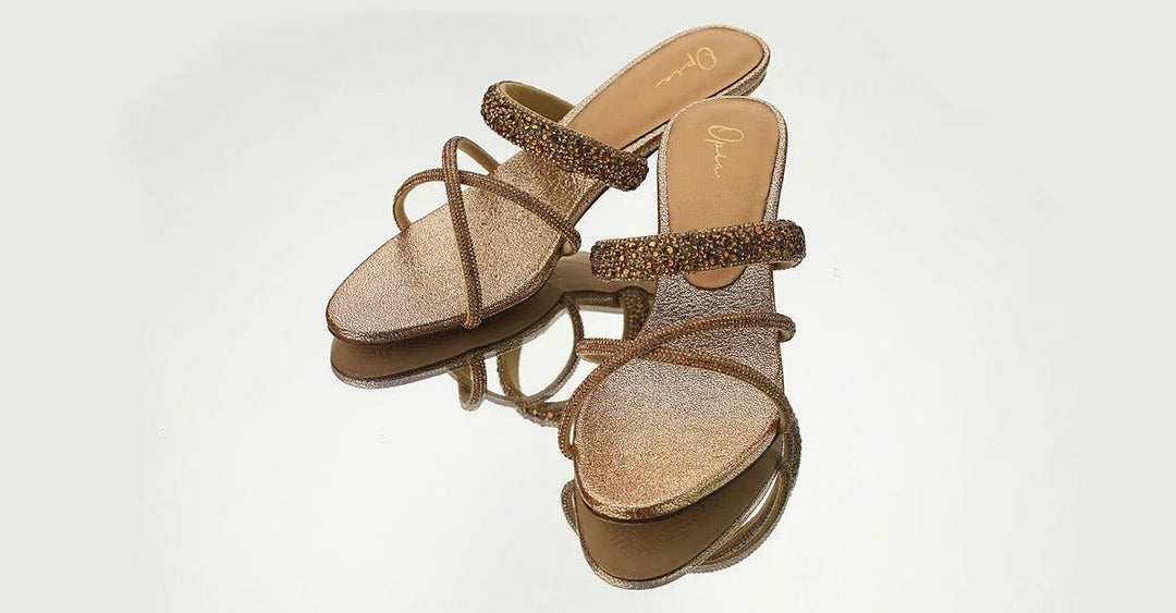 Pair of stylish women's glittery strappy sandals showcasing latest trends in women’s shoes by OPIA
